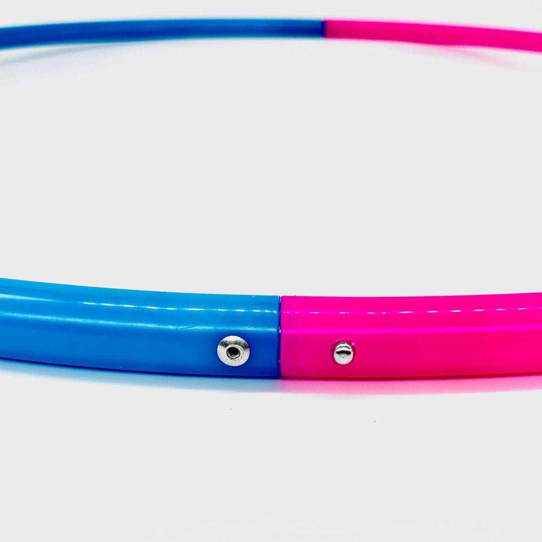 Nuclear pink and bioluminescent Blue sectional 2 piece hula hoop on a white background