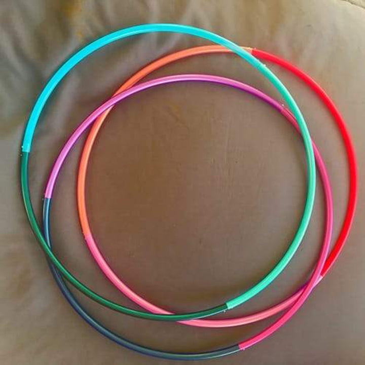 3 sectional hoops in a pile. Sectional travel hoops in 3 colours.