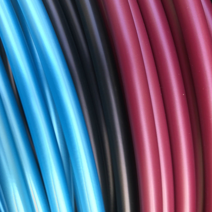 Black Cherry hula hoop tubing. High quality metallic hoop tubing coils in bright blue, black and black cherry. Best hula hoop tubing uk for hoop making