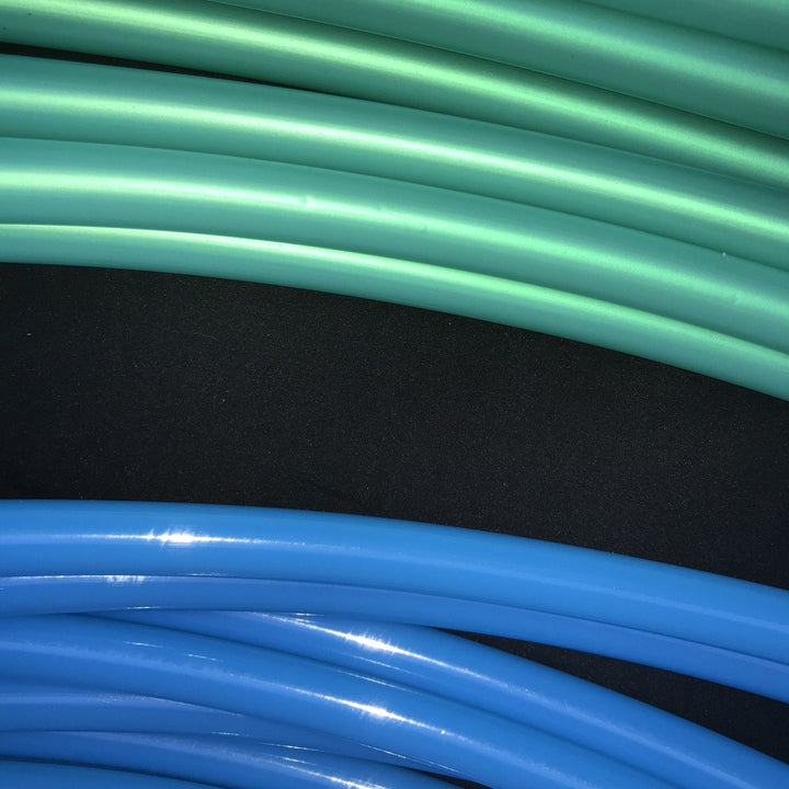 Caribbean Breeze hula hoop tubing above Bio blue tubing for contrast. Sea green polypro. Shiny hoop tubing