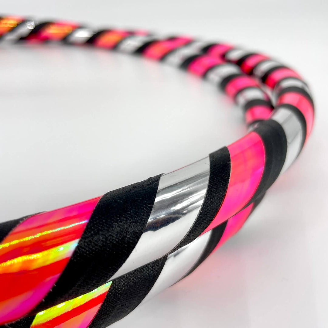 Nuclear pink bubblgum and silver striped hula hoop for hoop fitness and hoop dance