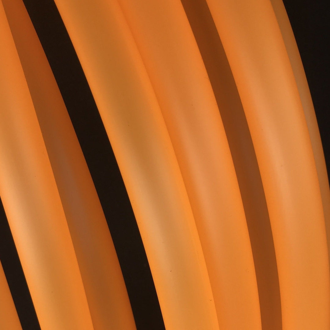 UV Orange semi translucent hoop tubing on black background