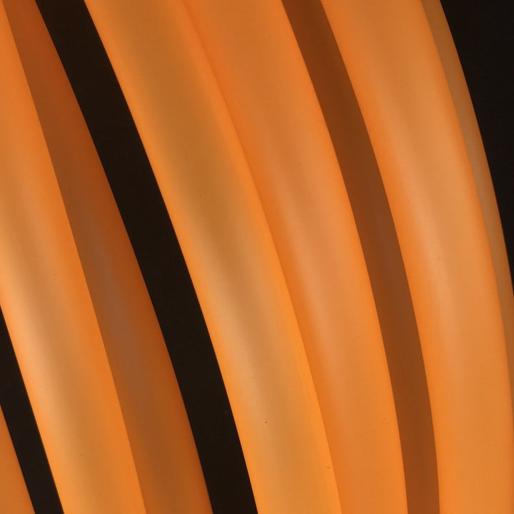 UV Orange semi translucent hoop tubing on black background